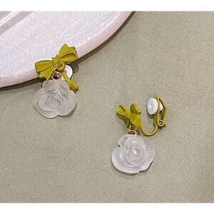 Clip on 1 1/4" gold, green bow and clear white dangle flower earrings